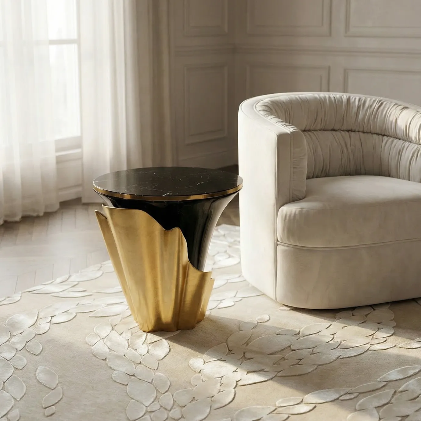 KOKET Ophidia Beige Rug in a neutral living room, featuring raised leaf-pattern relief beside an upholstered armchair and a brass side table