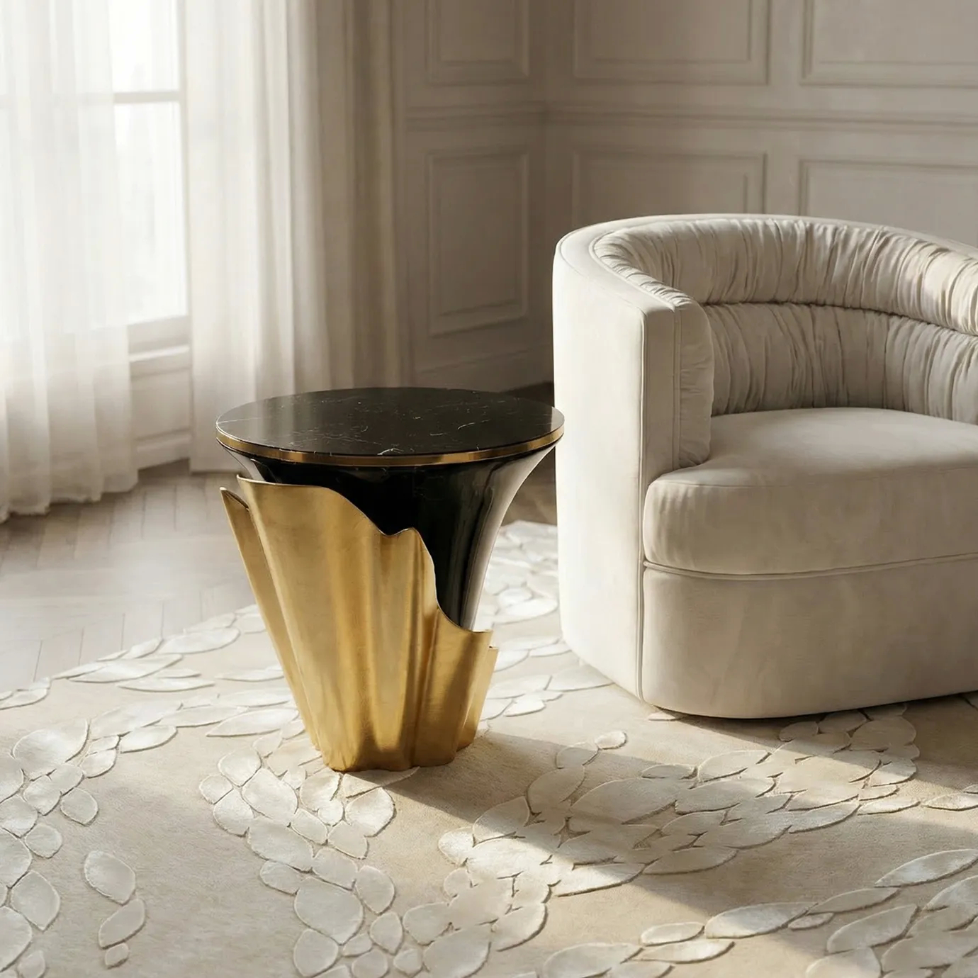 KOKET Ophidia Beige Rug in a neutral living room, featuring raised leaf-pattern relief beside an upholstered armchair and a brass side table