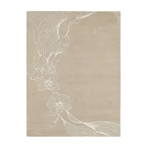 Minimalist KOKET Orchid rug in a soft cream palette with white floral line art, showcasing a delicate and elegant orchid design for luxury bedrooms.