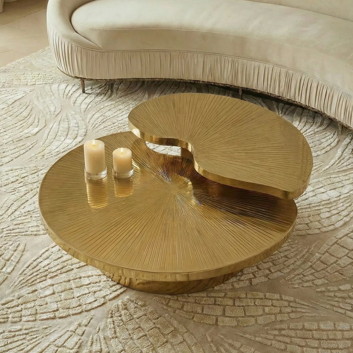 KOKET Terra Sand Rug with ivory raised leaf pattern styled under a gold coffee table and curved sofa