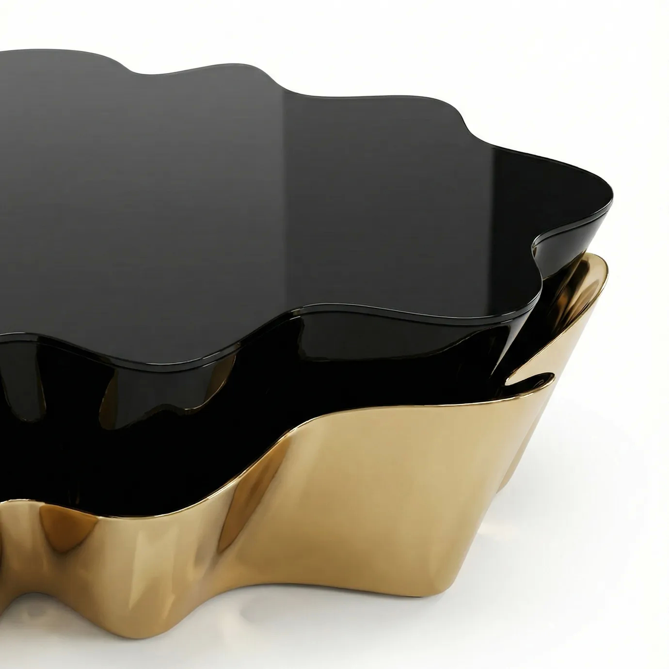 Close-up of the Yasmine Coffee Table by KOKET highlighting the fluid silhouette, high-gloss black lacquer top, and sculptural polished brass base, luxury designer coffee table detail.