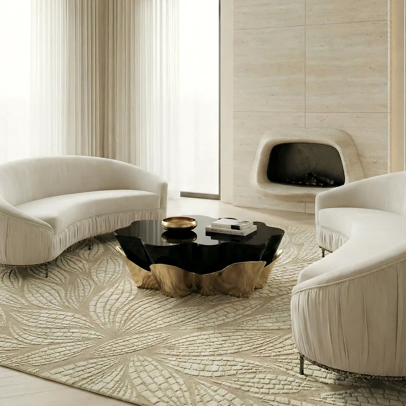 Yasmine Coffee Table by KOKET with sculptural polished brass base and glossy black lacquer top, styled with the Vamp metal base sofa and the Terra Sand Rug from KOKET’s new rug collection in a refined luxury living room setting.