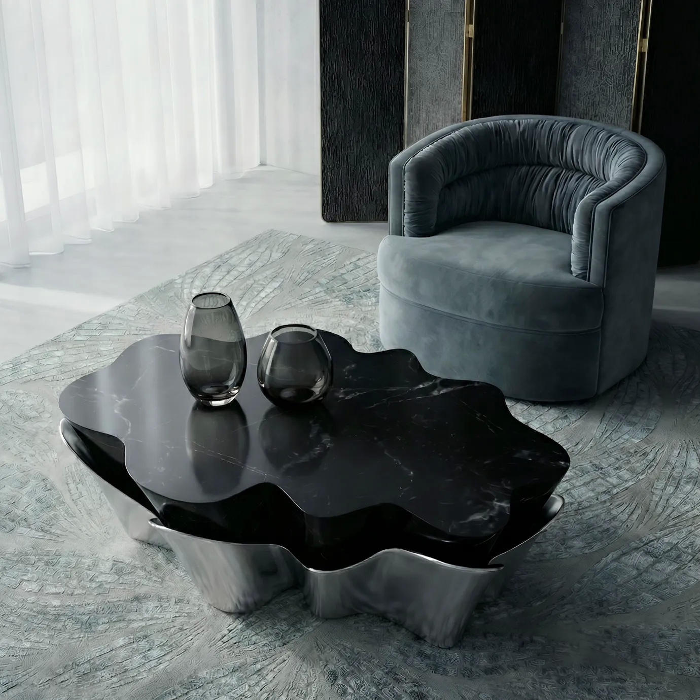Yasmine Coffee Table by KOKET with sculptural silver metal base and black marble top, styled with the Cocktail Armchair and Terra Rug in a refined contemporary living space.