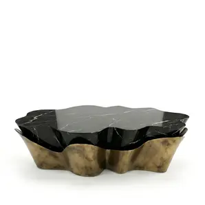 KOKET Yasmine Coffee Table in Aged Gold Powder, sculptural undulating base with a Nero Marquina marble top.