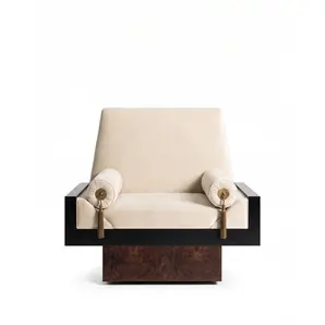 Lola armchair by KOKET in cream velvet, bolsters with polished brass medallions and tassels, black lacquer and walnut veneer.