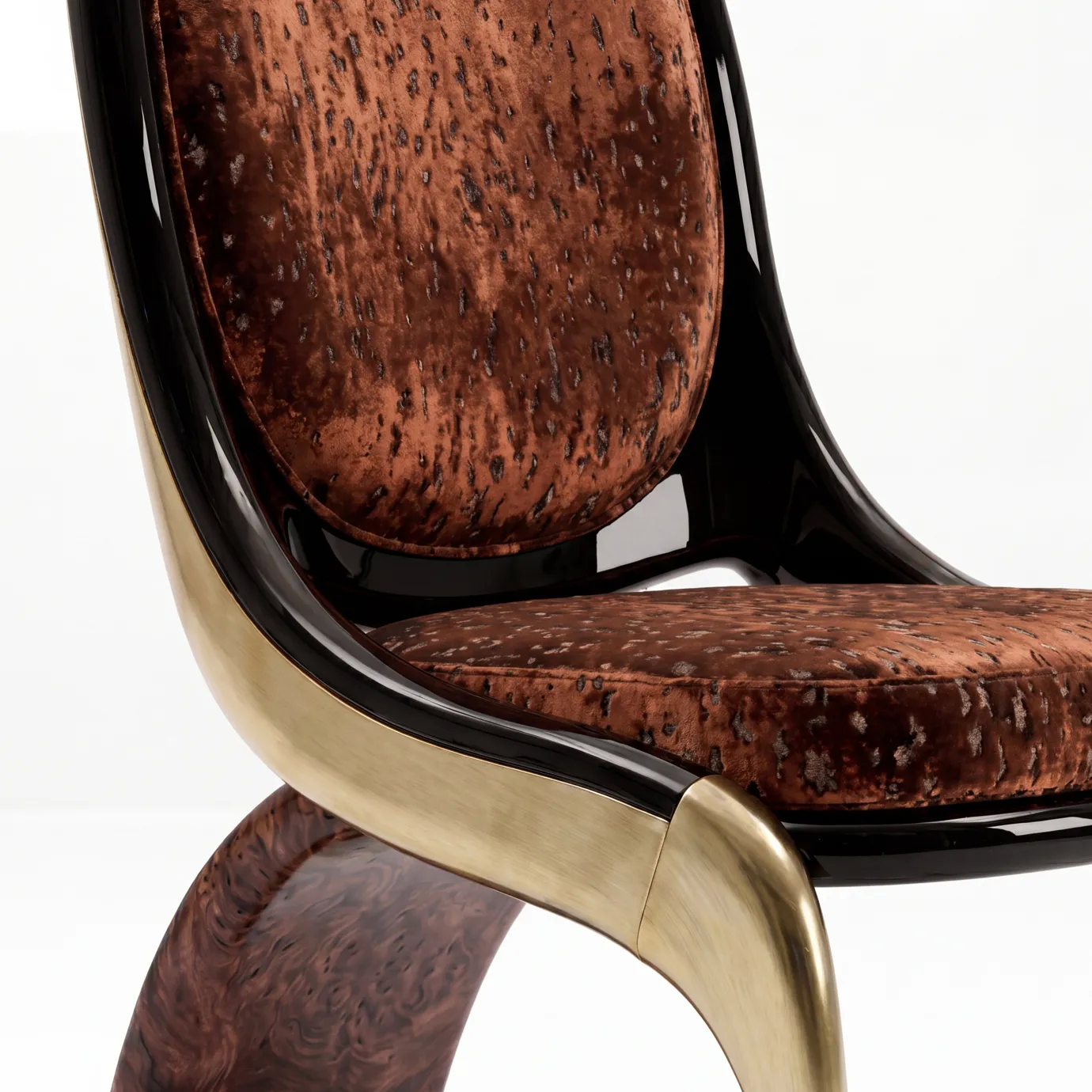 Detail of Gabrielle dining chair by KOKET: mottled rust velvet, black lacquer shell, brushed brass and walnut burl.