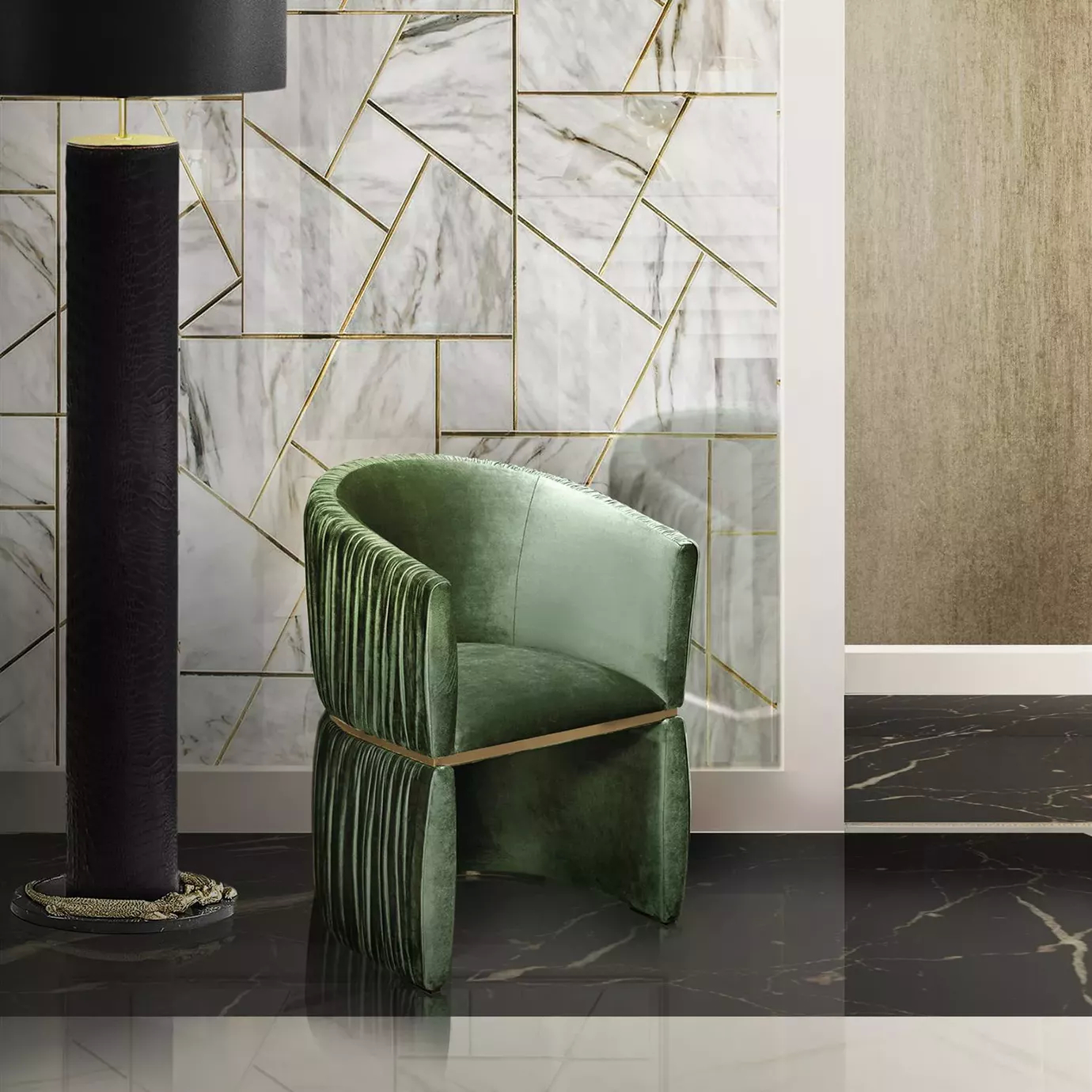 Elegant Cuff Chair upholstered in green velvet with pleated details and a golden frame in a sophisticated room with geometric marble wall cladding.