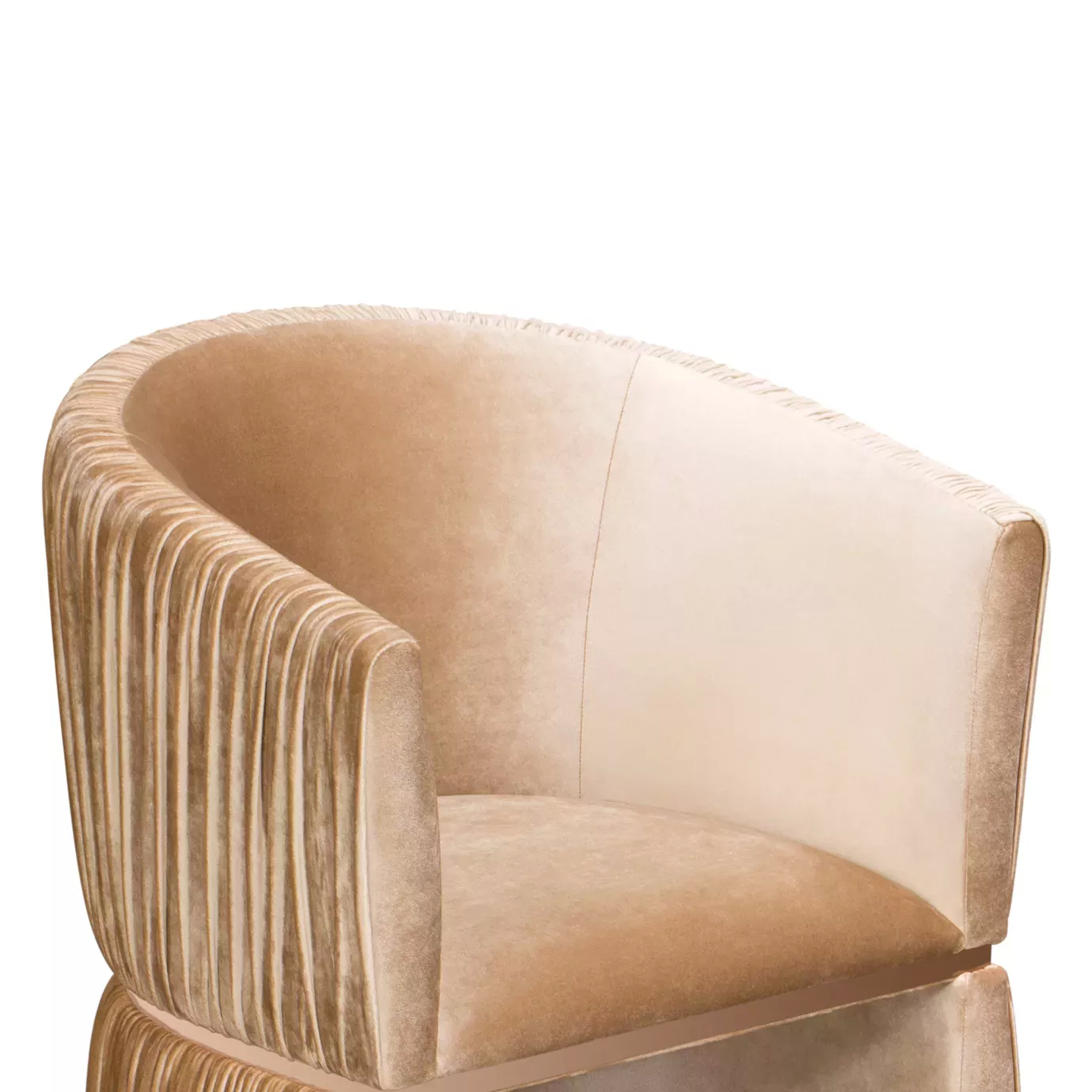 Elegant close-up of the pleated detail of the peach-toned velvet of the Cuff Chair.
