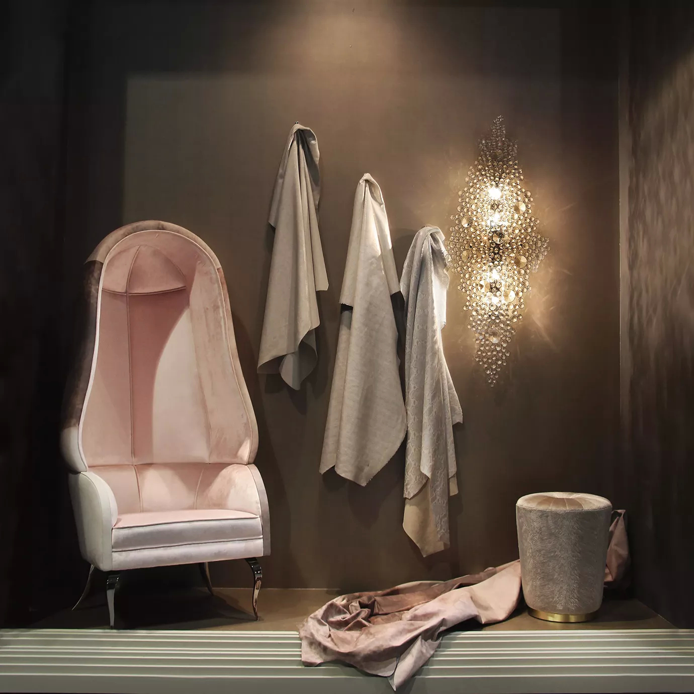 Elegant Drapesse tall chair with Watermark leather back and soft pink velvet upholstery in a sophisticated setting with dramatic lighting and textured details.
