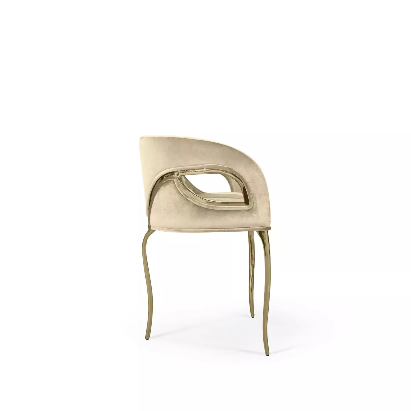 Side perspective of the glamourous Chandra Chair, distinguished for its three legs, featuring a golden structure and cream upholstery.
