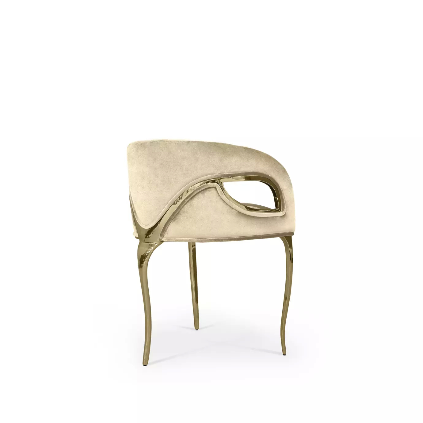 Side view of the Chandra Chair, notable for its three golden legs and cream velvety upholstery, creating an elegant combination.