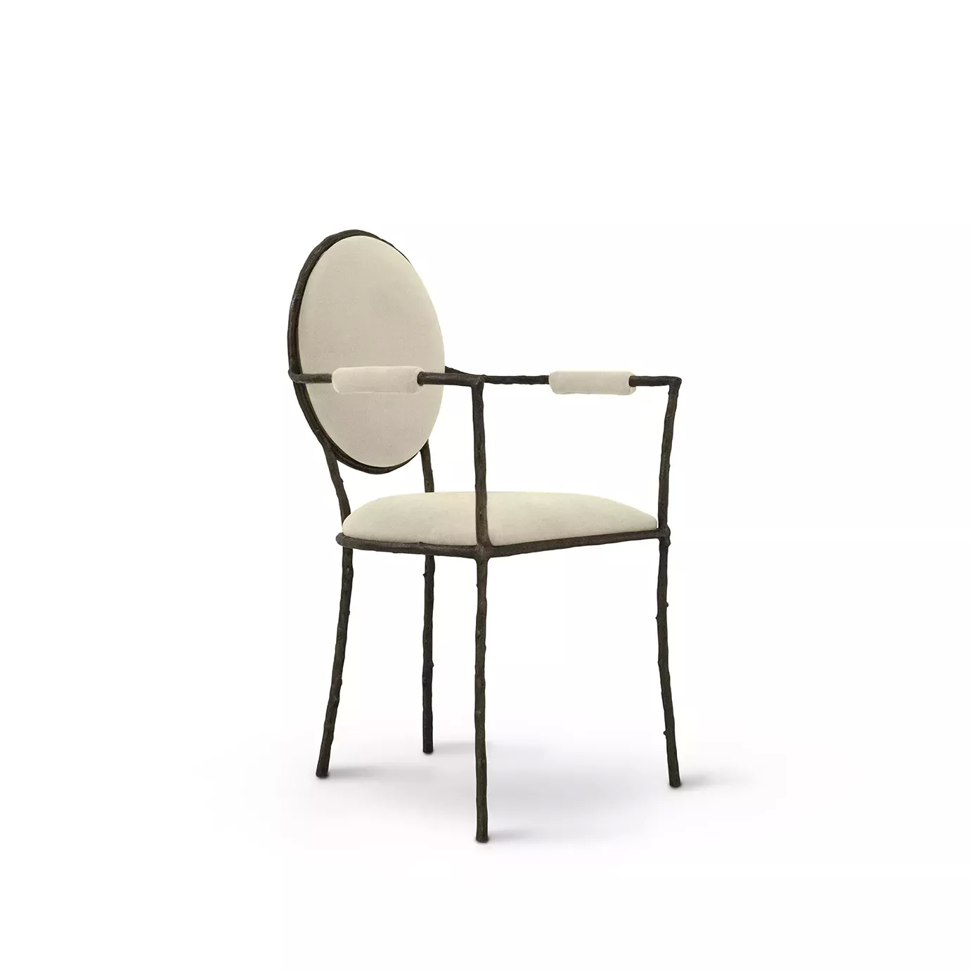 Slight side view of the Enchanted Arm Dining Chair, showcasing its aged brass frame resembling branches, combining with the luxurious cream upholstery.