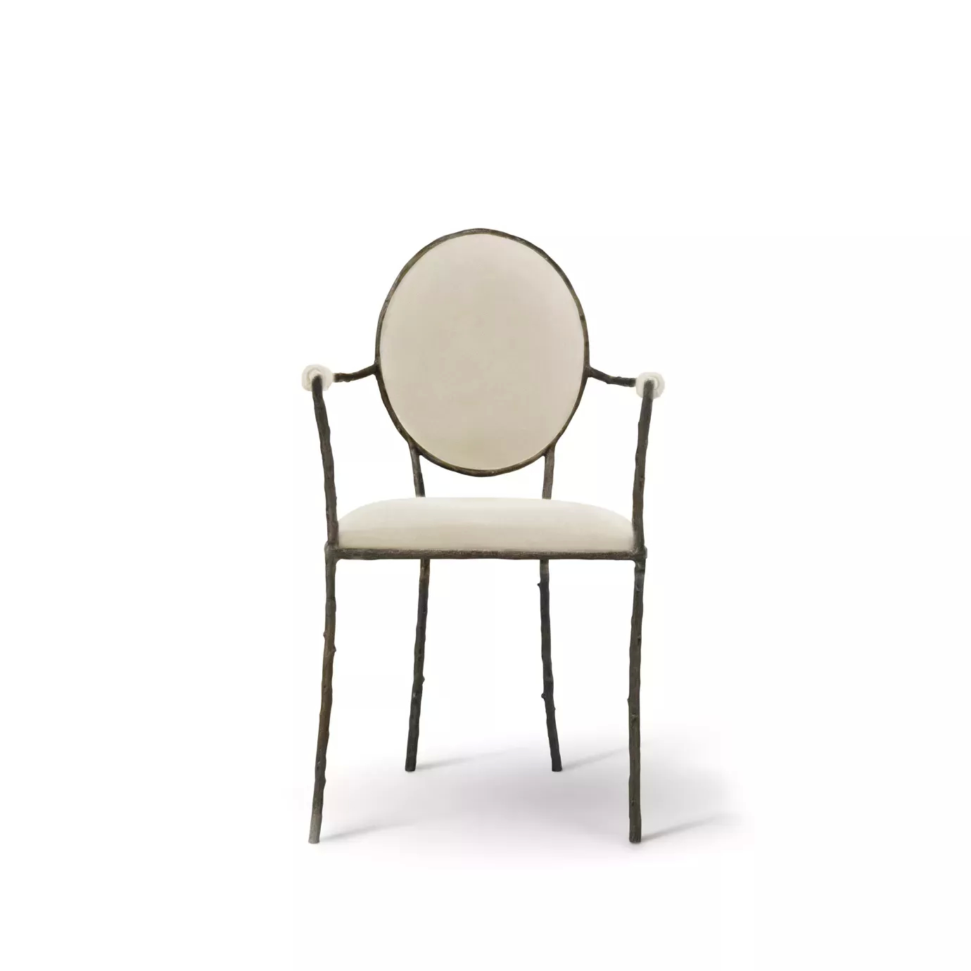 Enchanted Arm Dining Chair features an aged brass frame resembling branches and luxurious cream upholstery.