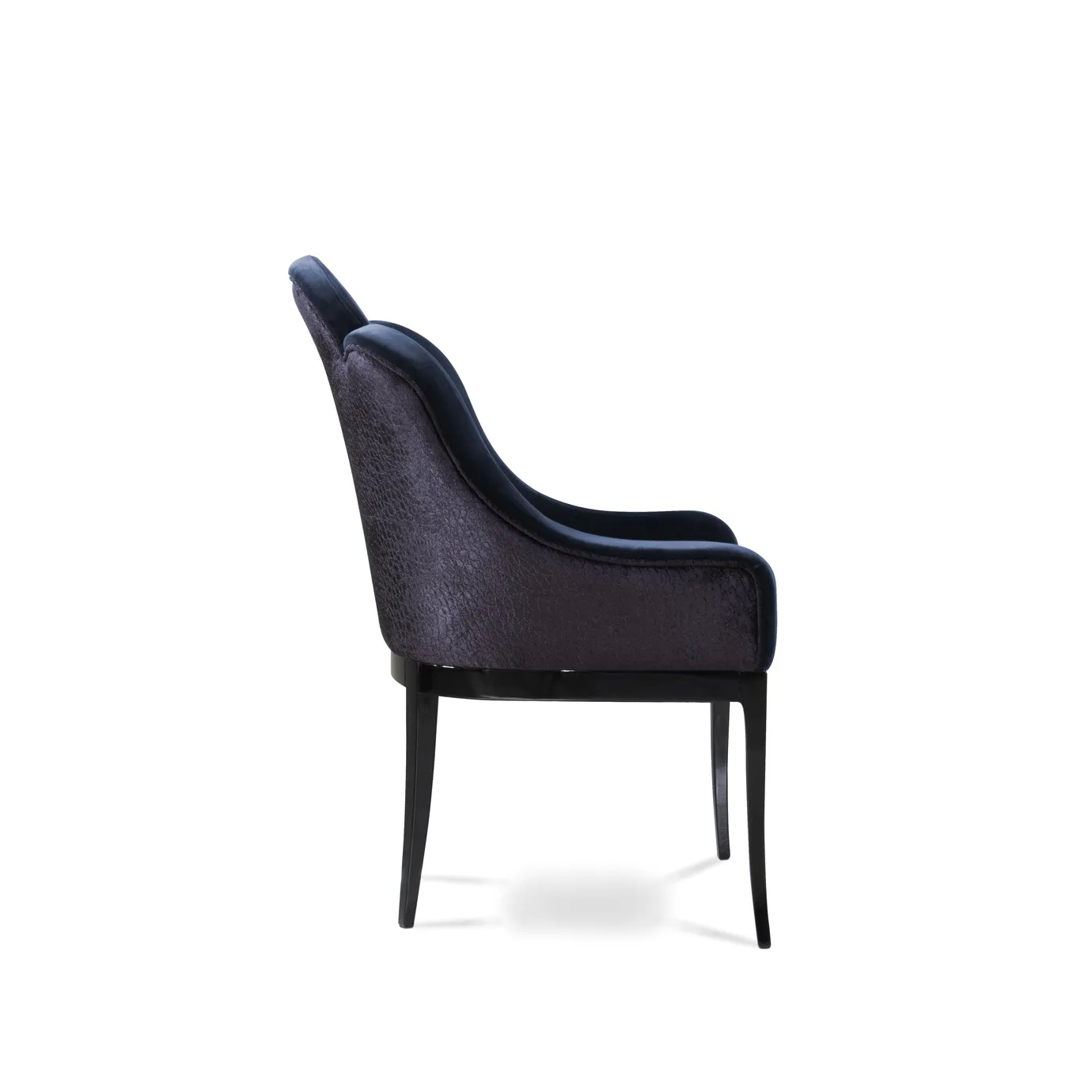 Elegant side view of Anastasia Dining Chair upholstered in deep blue velvet with a textured side detail and dark legs.
