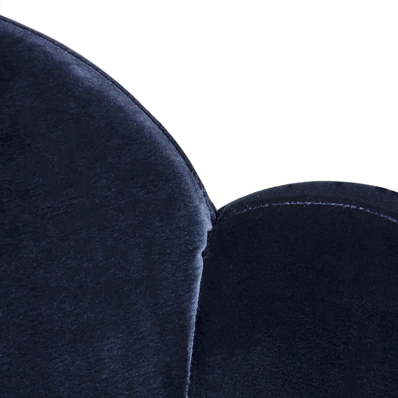 Elegant close-up of the deep blue velvet upholstery of the backrest of the Anastasia Dining Chair.