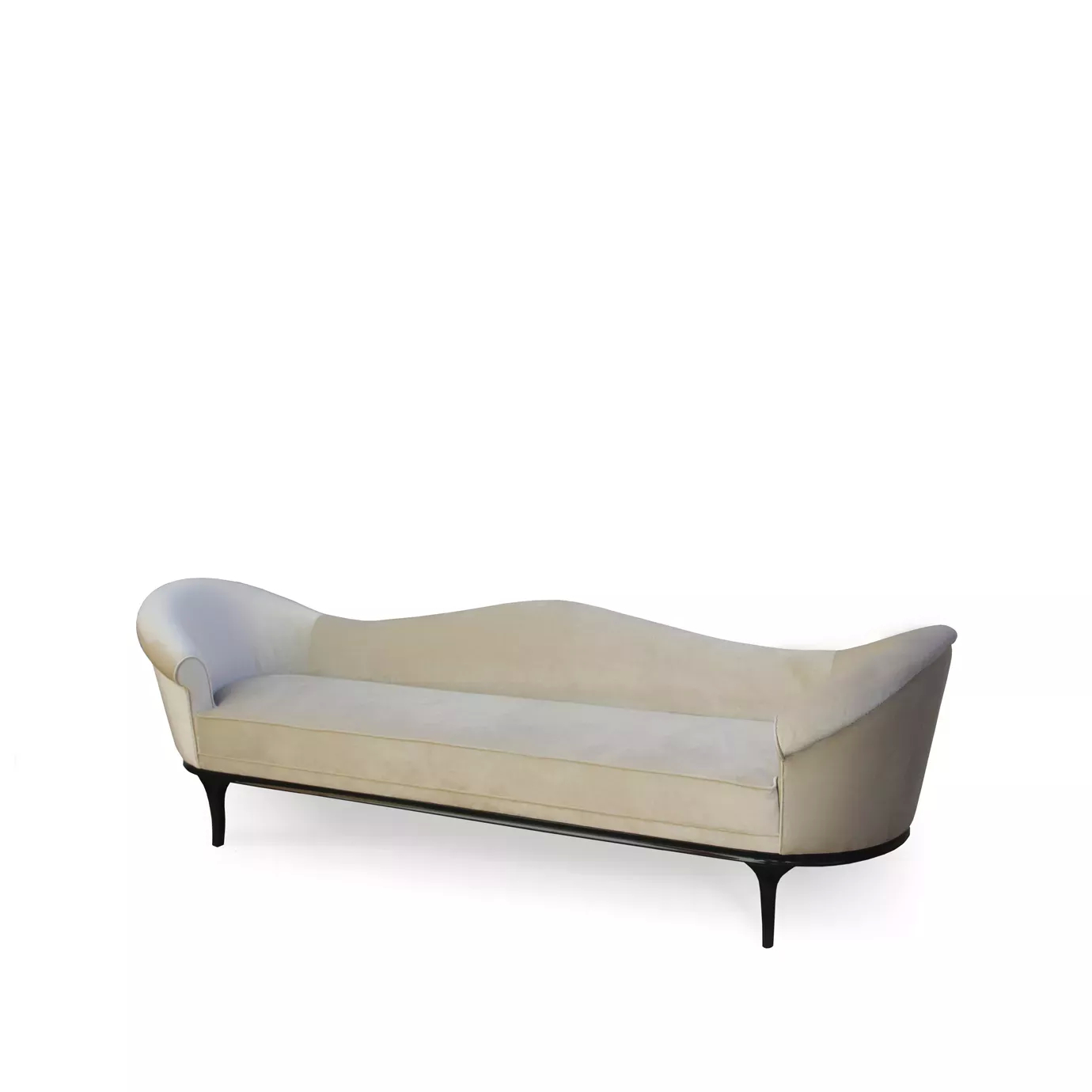 The Colette Sofa by Koket features a gently curved silhouette, upholstered in a soft, light-colored fabric, and supported by sleek, dark legs.