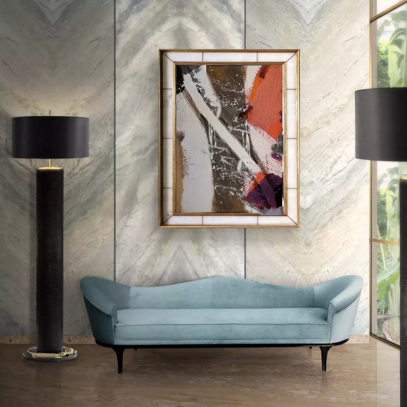 The Colette Sofa by Koket, in a soft blue velvet, graces an elegant room with marble walls, abstract art, and sleek black floor lamps.