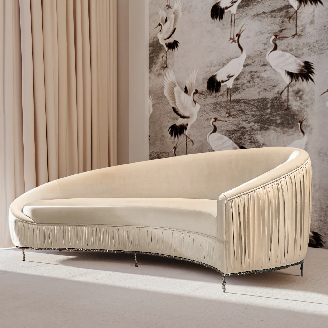 Elegant Vamp Sofa with an ornate golden metal base and cream fabric upholstery with pleated details on one end, in a sophisticated interior with decorative wallpaper.