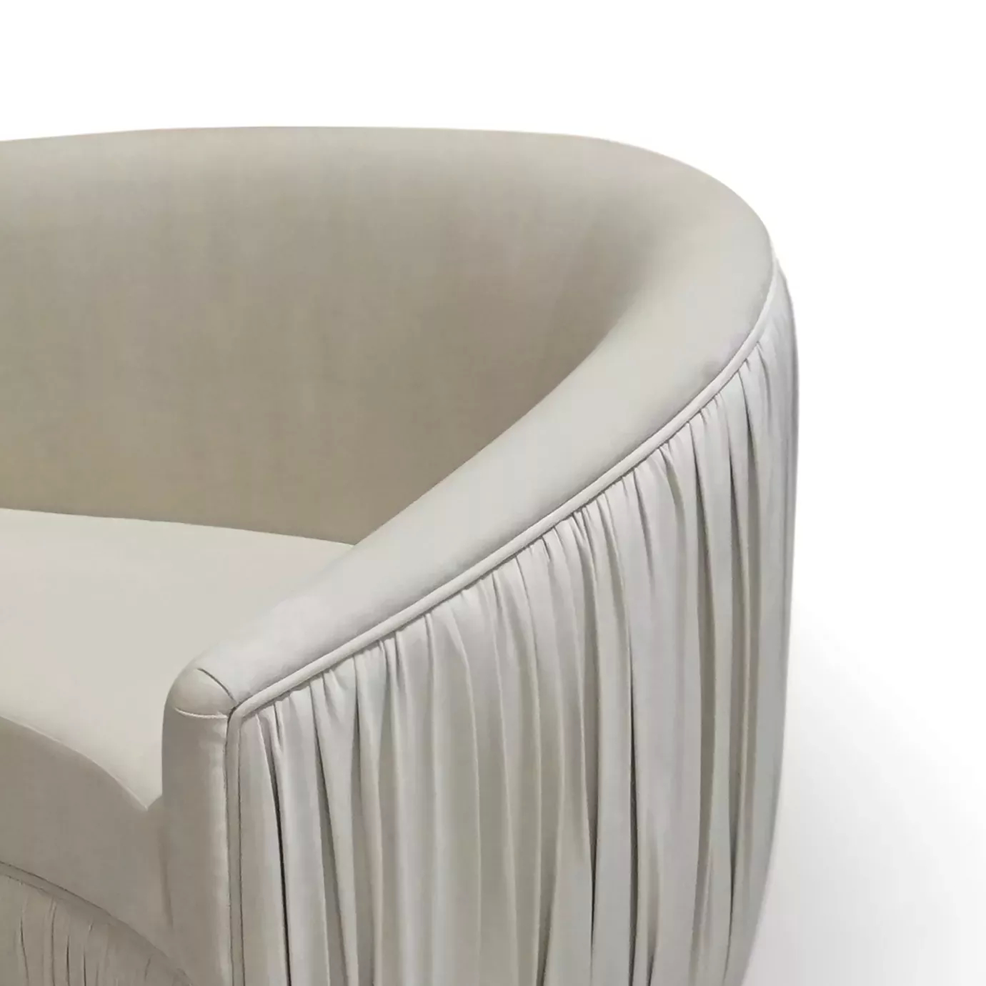 Elegant close-up of the pleated detail of the cream fabric of the Vamp Sofa.