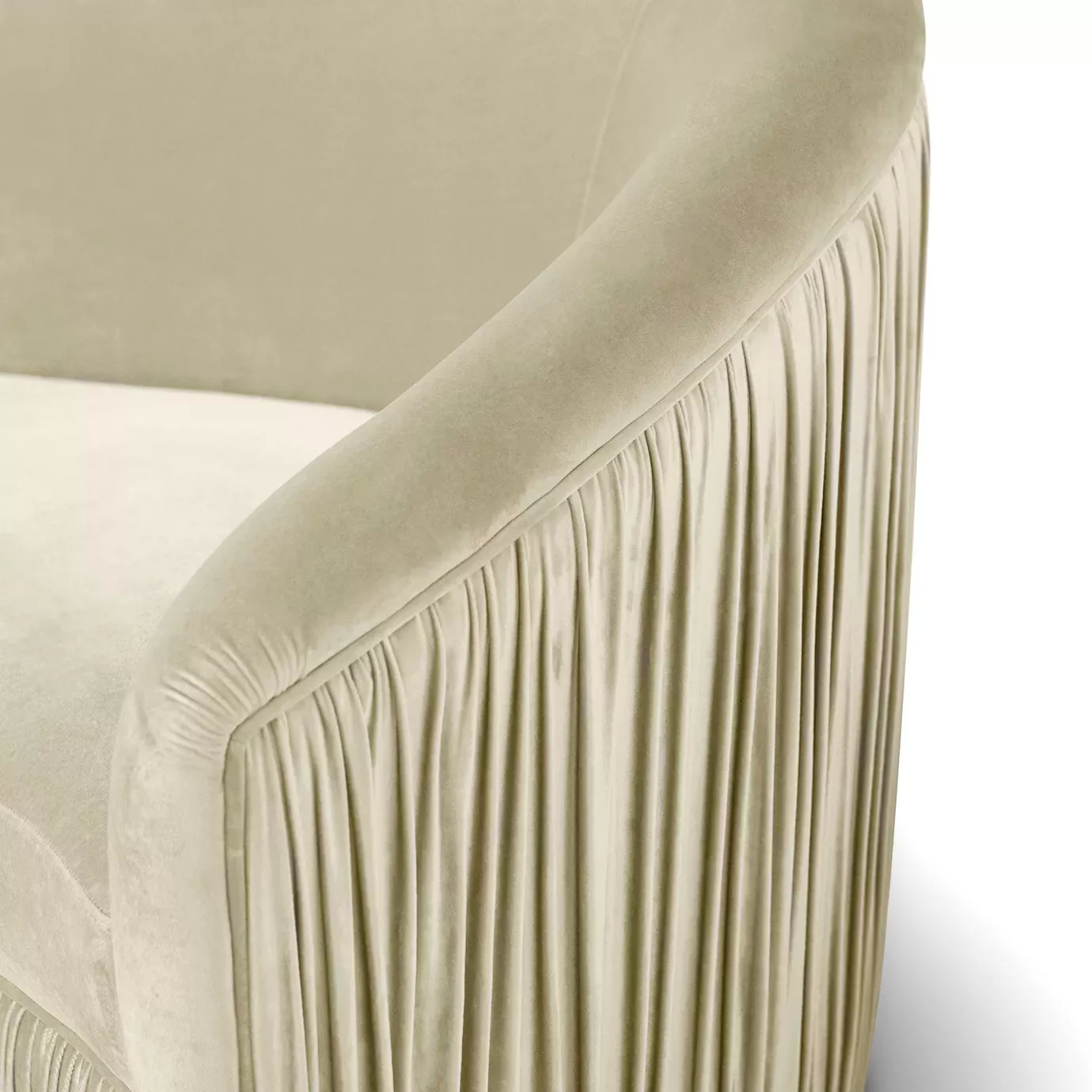 Elegant close-up of the pleated detail of the cream fabric of the fully upholstered Vamp Sofa.