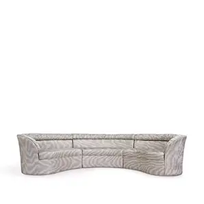 Elegant modular Entice Sofa upholstered in textured fabric in shades of grey with a curved design.