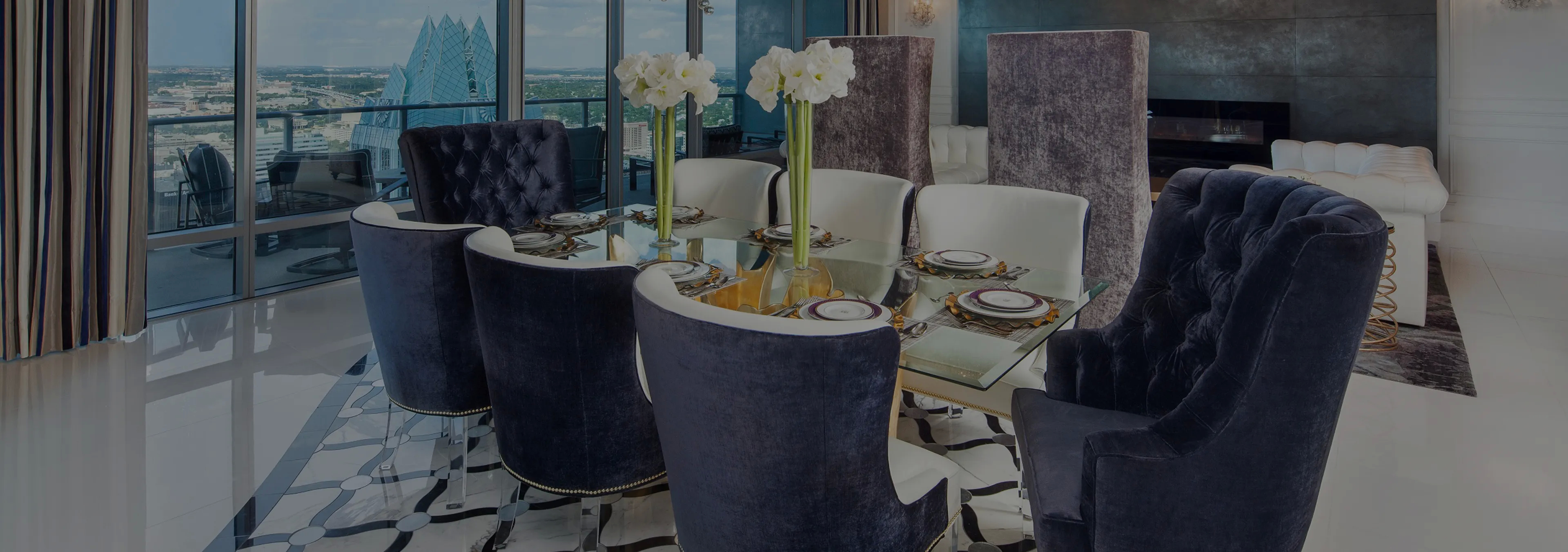 Labor of Love: Two Naomi chairs with golden velvet upholstery and black legs, with a decorative glass vase.