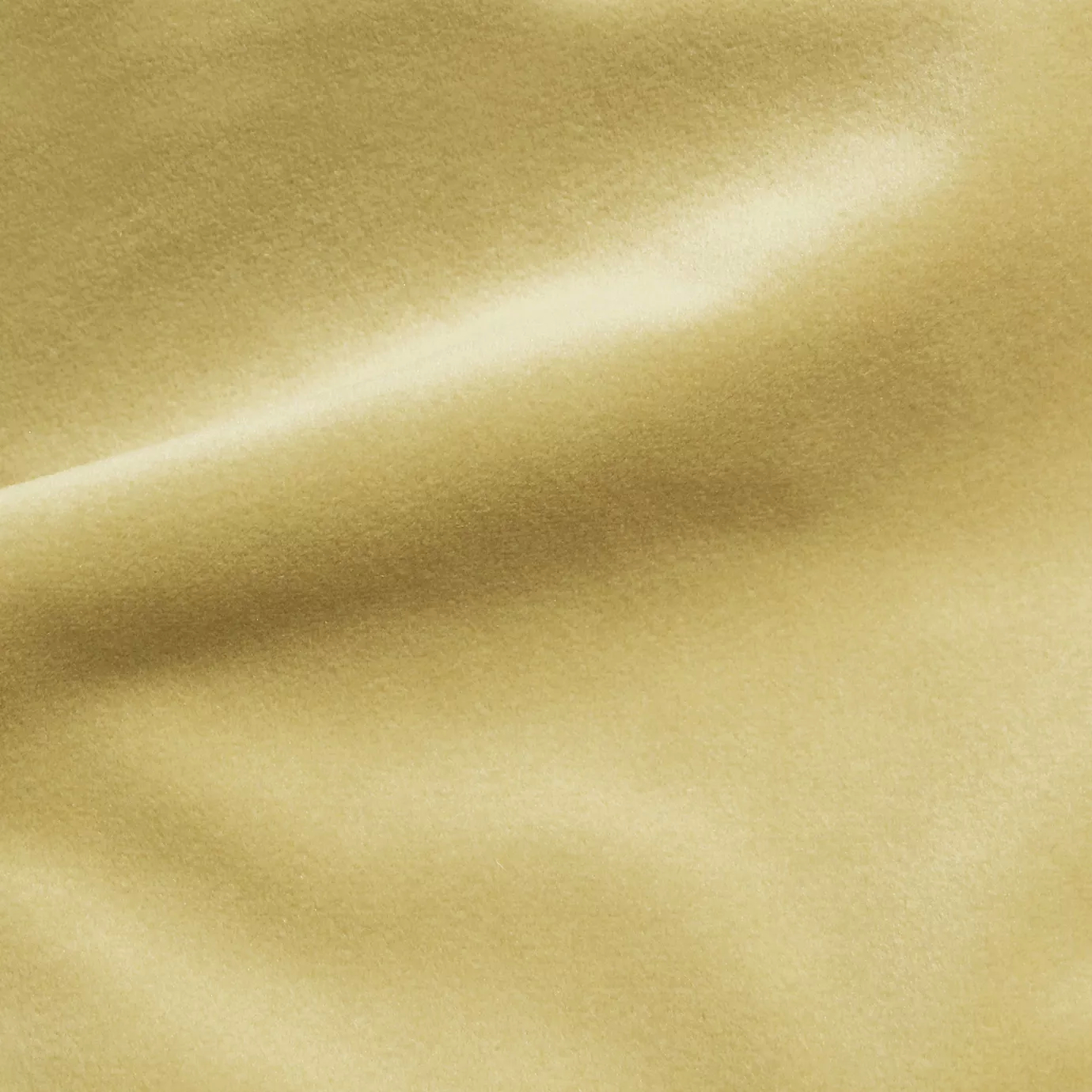 Elegant close-up of a Cozy Velvet Nude Cream fabric swatch in a soft nude cream tone, showcasing its smooth and luxurious texture with gentle folds that highlight its subtle sheen.