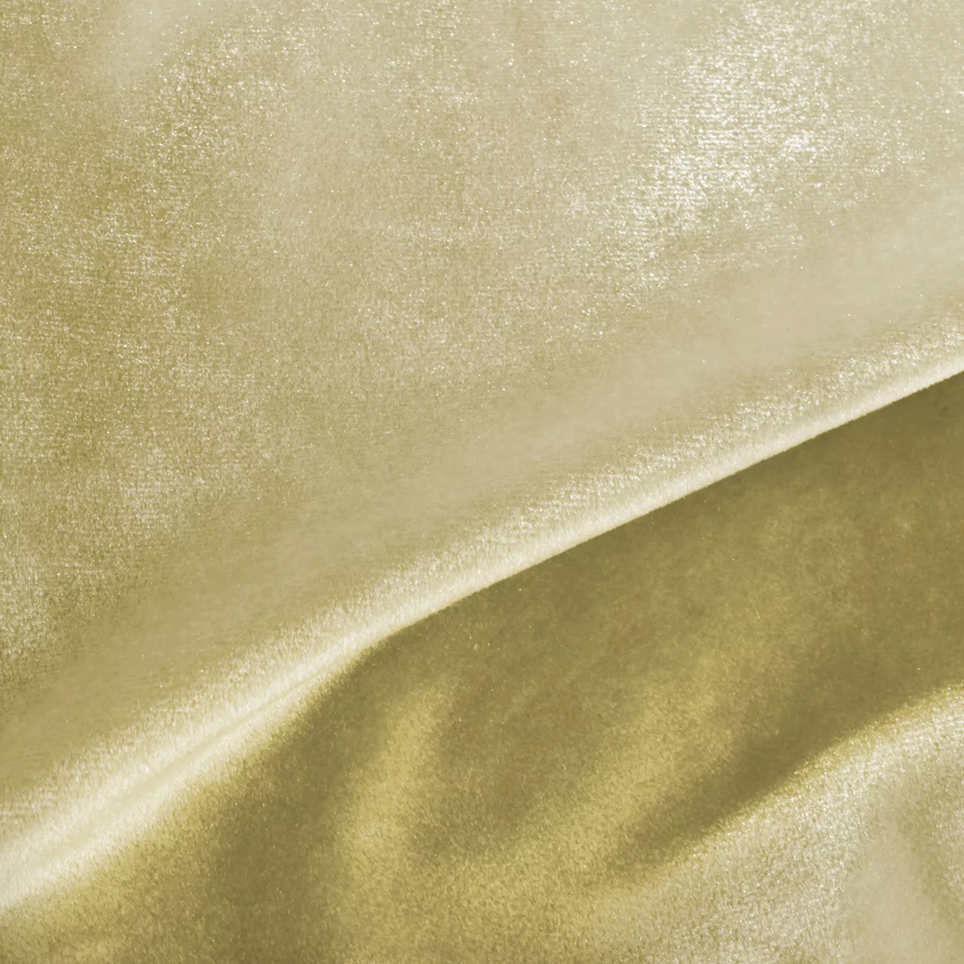 Elegant close-up of a Silky Velvet 407 fabric swatch in a light and luminous golden tone, showcasing its smooth texture and silky sheen with gentle folds that catch the light.
