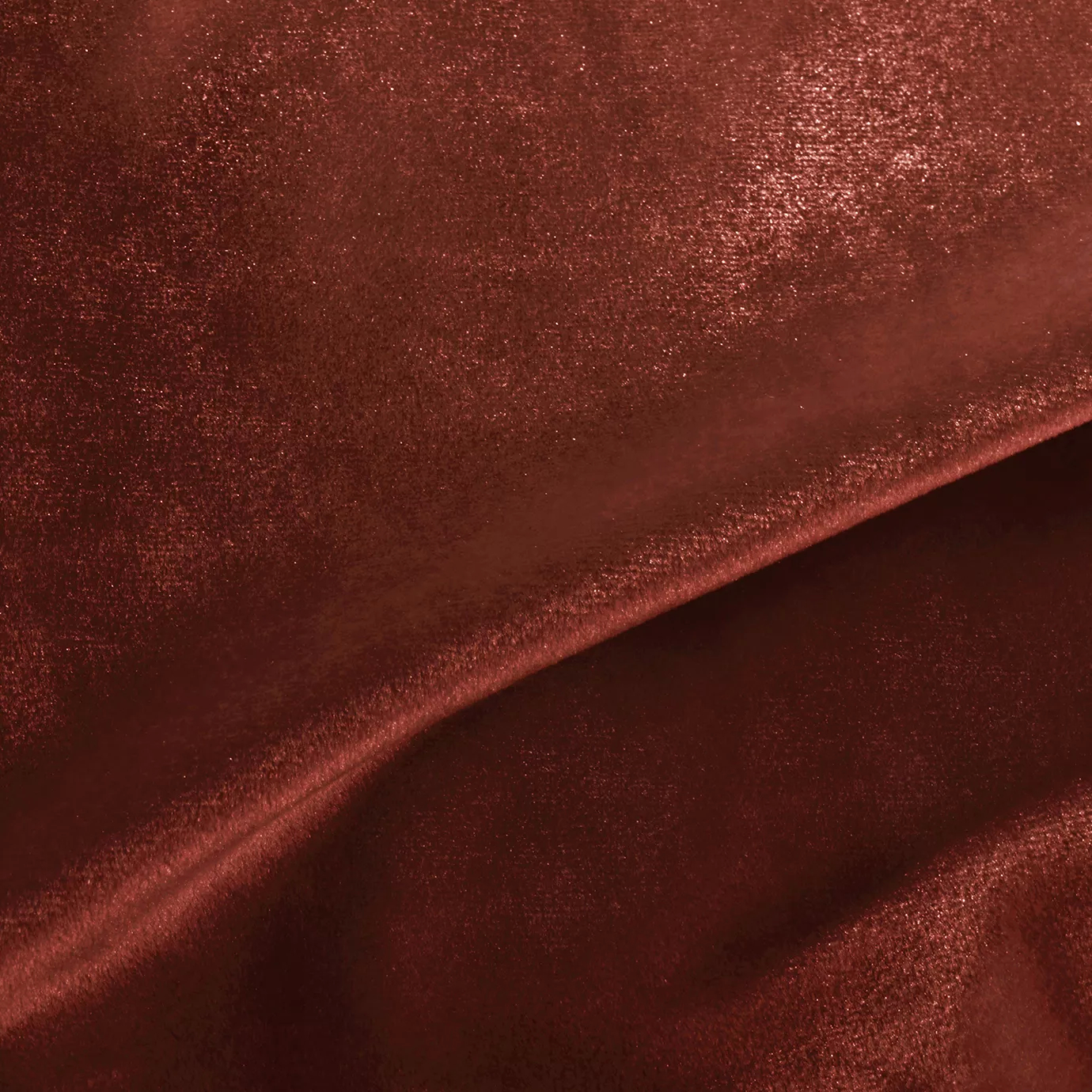 Elegant close-up of a Silky Velvet 412 fabric swatch in a luminous and warm terracotta tone, showcasing its smooth texture and the delicate folds that highlight its silky sheen.