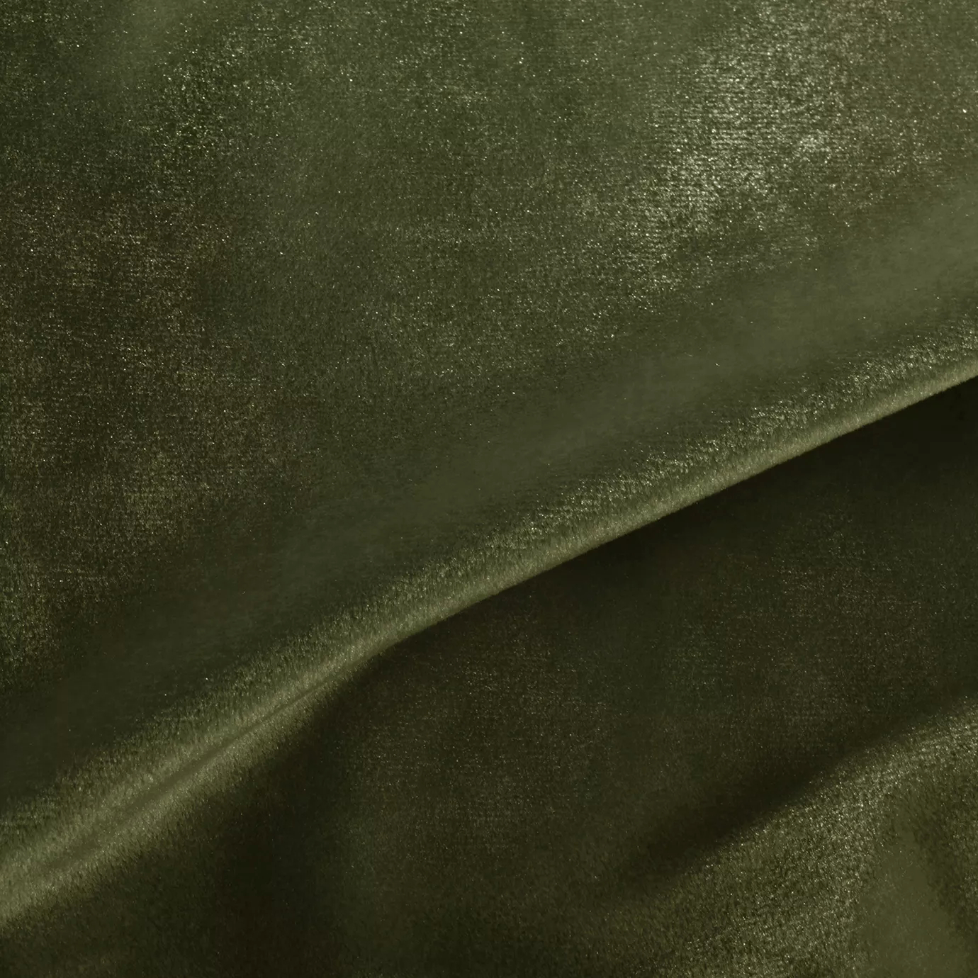 Elegant close-up of a Silky Velvet 424 fabric swatch in a luminous and soft moss green tone, showcasing its smooth texture and the delicate folds that highlight its natural and silky sheen.
