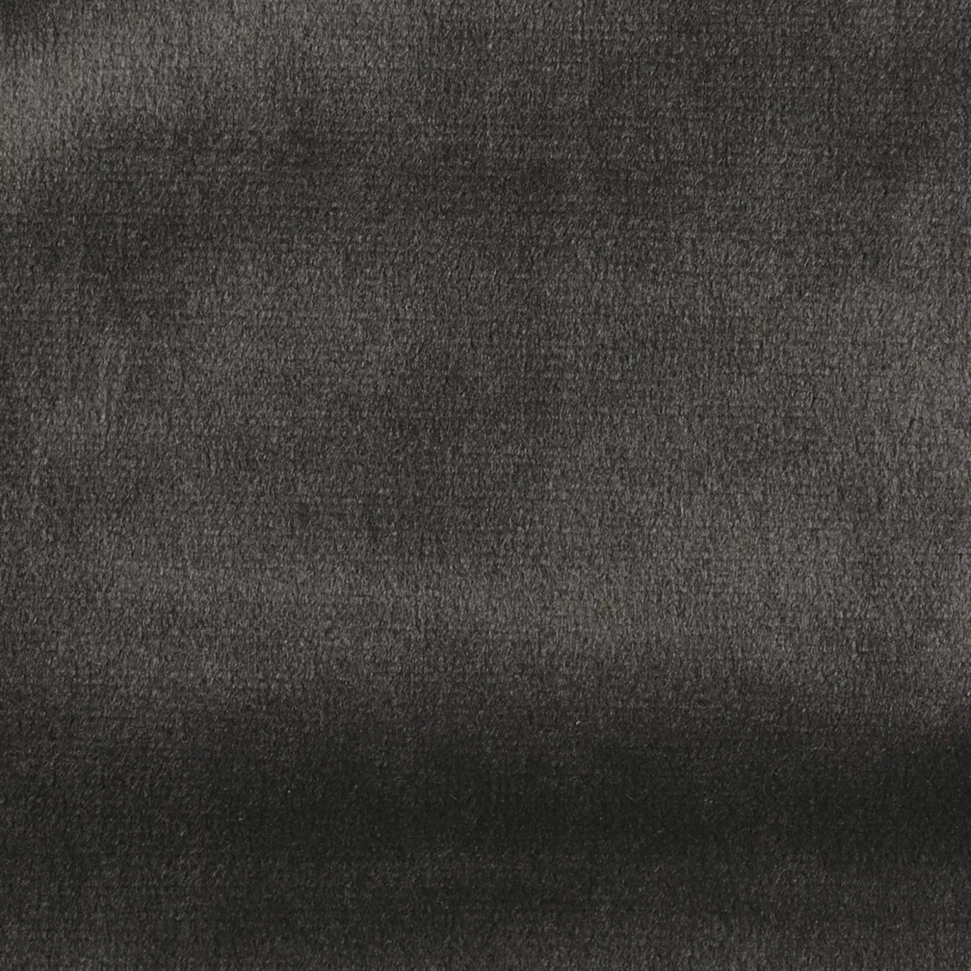 Elegant close-up of a Radiance Velvet Pavement Gray fabric swatch in a modern and neutral pavement gray tone, showcasing its velvety texture and a subtle sheen that gives it a feeling of sophisticated urban comfort.