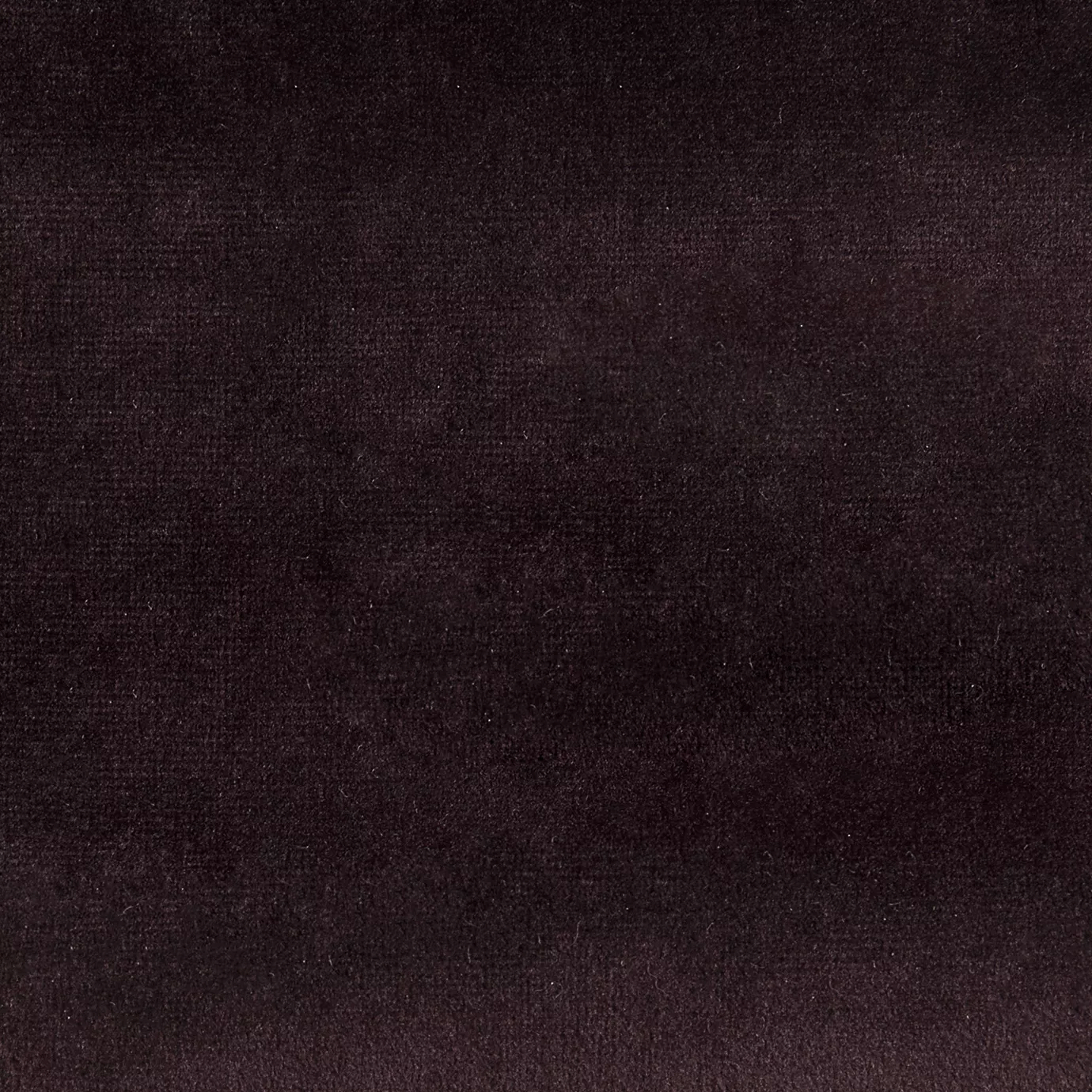 Elegant close-up of a Paris Velvet Bordeaux fabric swatch in a rich and sophisticated bordeaux tone, showcasing its velvety texture and a subtle sheen that gives it a feeling of comfort and deep elegance.