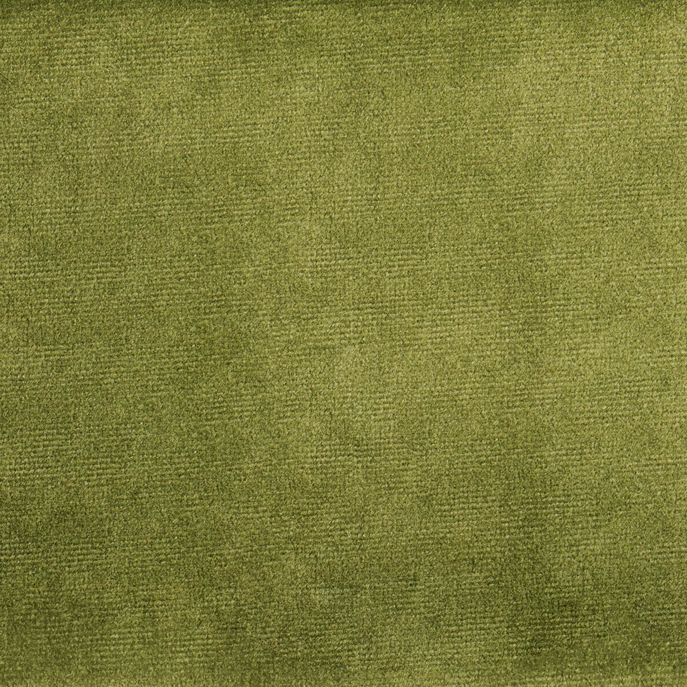 Elegant close-up of a Paris Velvet Lima fabric swatch in a vibrant and luminous lime green tone, showcasing its velvety texture and a subtle sheen that gives it a feeling of comfort and vivacity.