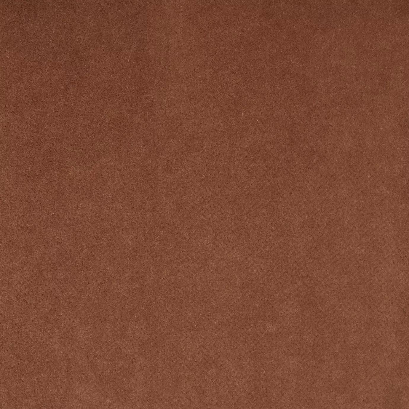 Soft and elegant close-up of a Lux Velvet Chic Salmon 1607 fabric swatch in a chic and sophisticated salmon tone, showcasing its velvety texture and a delicate sheen that gives it a feeling of comfort and natural elegance.