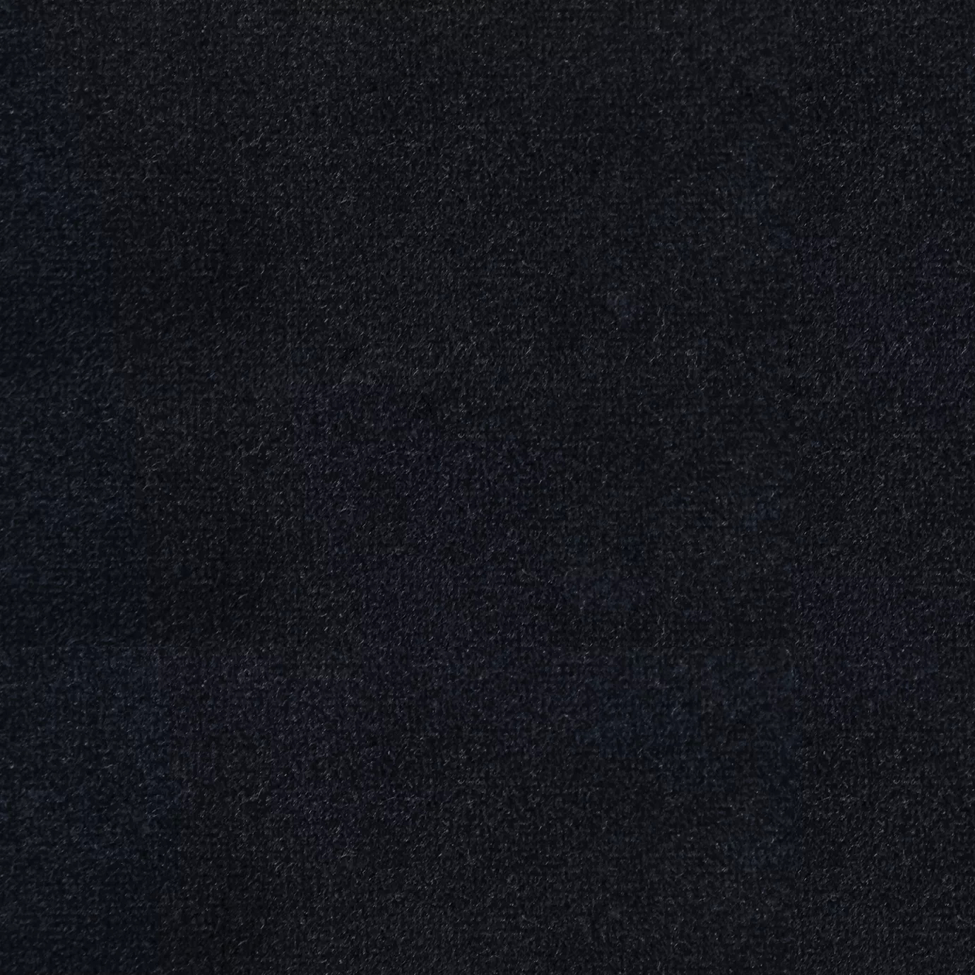 Soft and elegant close-up of a Lux Velvet Deep Blue 0668 fabric swatch in a deep and sophisticated blue tone, showcasing its velvety texture and a delicate sheen that gives it a feeling of comfort and intense elegance.