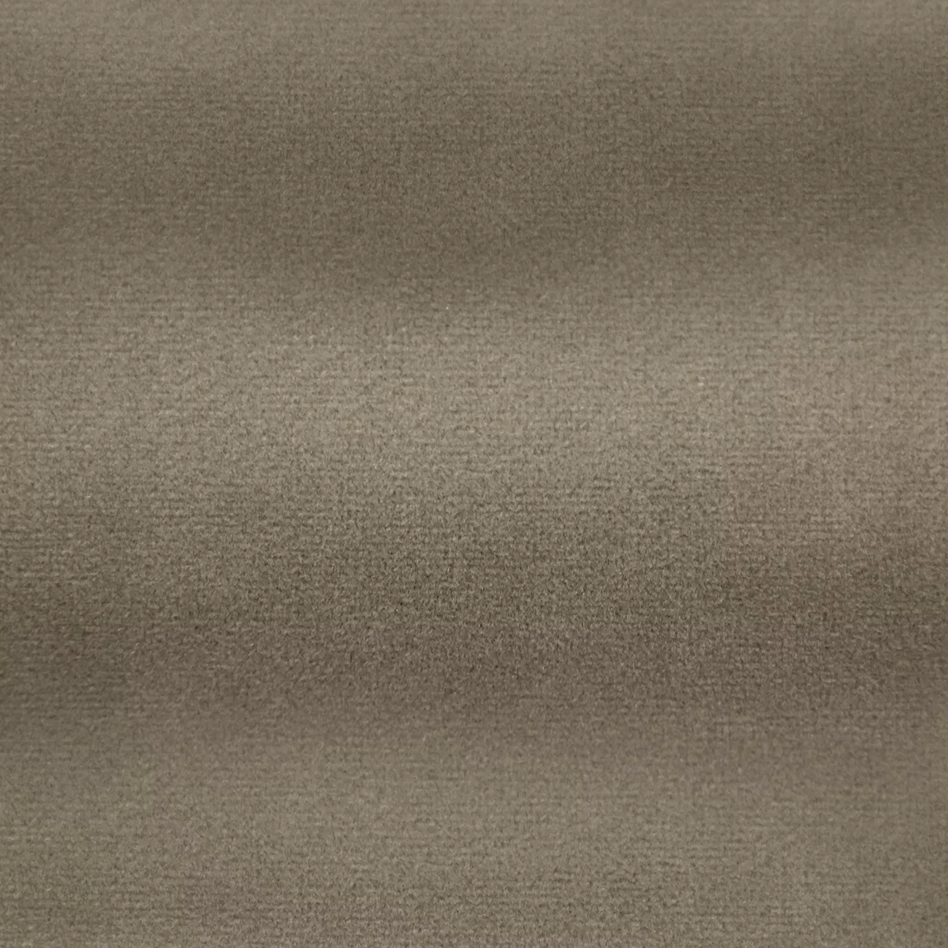 Soft and elegant close-up of a Lux Velvet Taupe 0083 fabric swatch in a soft and neutral taupe tone, showcasing its velvety texture and a delicate sheen that gives it a feeling of comfort and understated elegance.