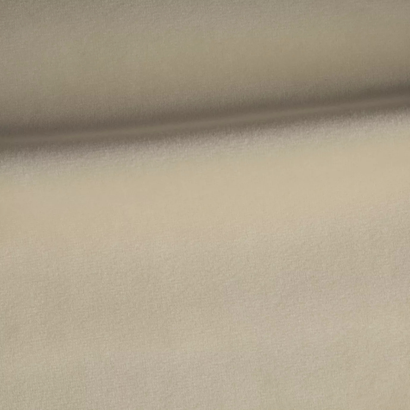 Soft and elegant close-up of a Venice Velvet 30 fabric swatch in a light and luminous beige tone, showcasing its velvety texture and a delicate sheen that gives it a feeling of comfort and timeless elegance.
