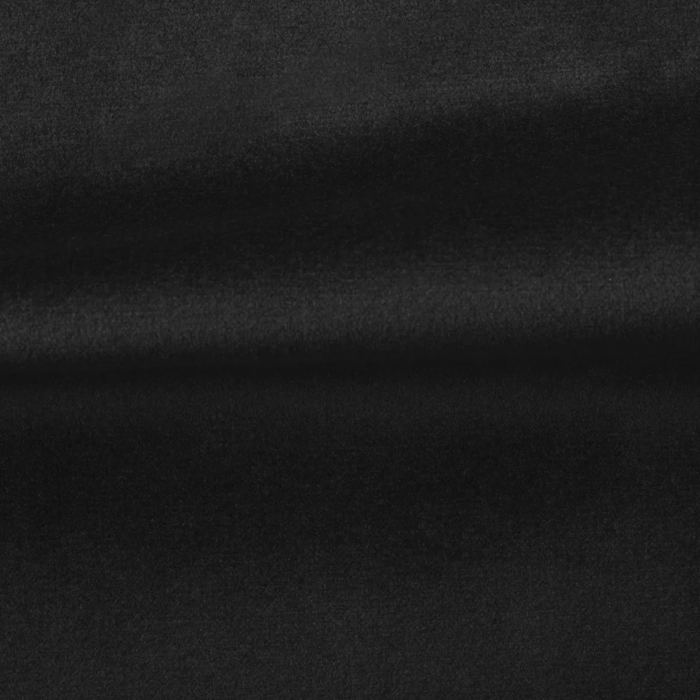 Soft and elegant close-up of a Venice Velvet 37 fabric swatch in a deep and intense black tone, showcasing its velvety texture and a delicate sheen that gives it a feeling of comfort and timeless elegance.