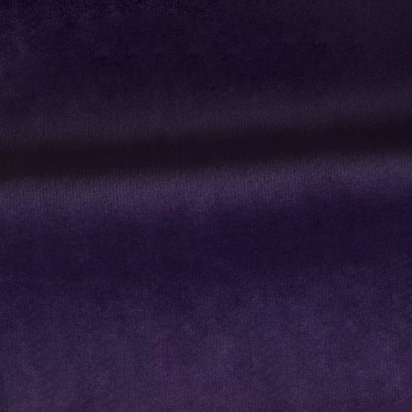 Soft and elegant close-up of a Venice Velvet 50 fabric swatch in a rich and sophisticated purple tone, showcasing its velvety texture and a delicate sheen that gives it a feeling of comfort and intense elegance.