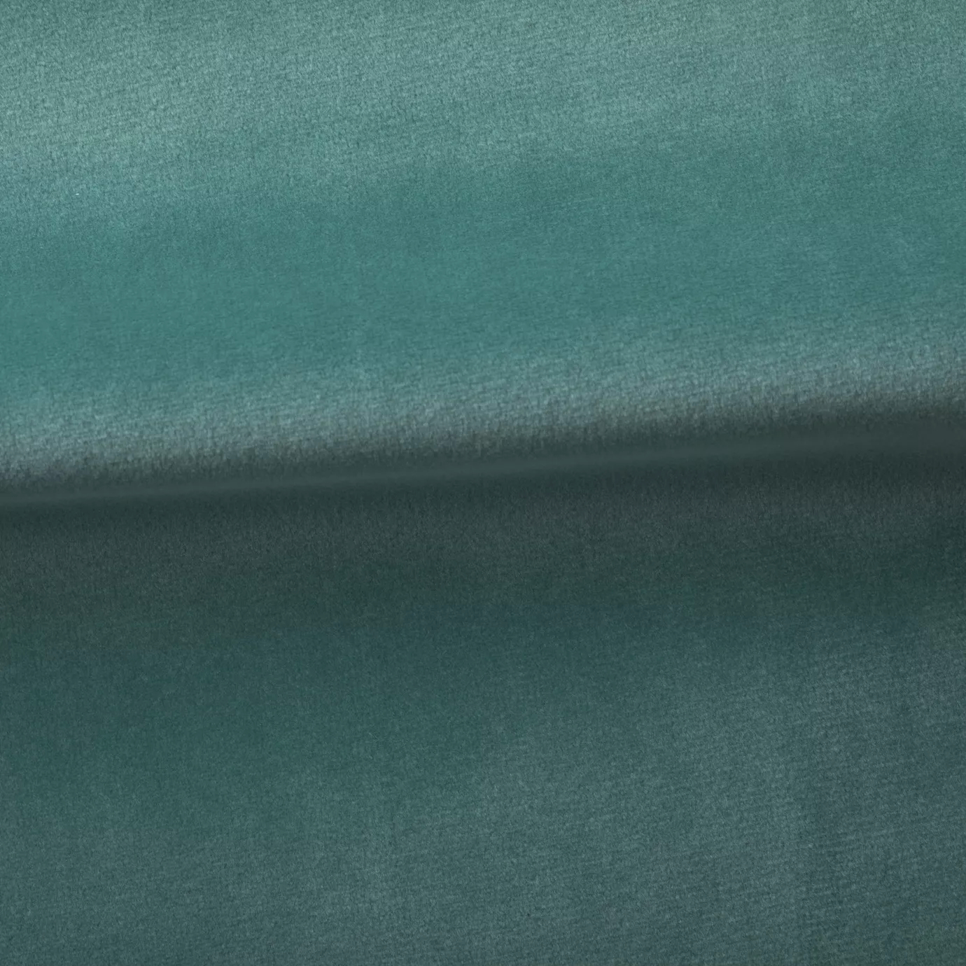 Soft and elegant close-up of a Venice Velvet 58 fabric swatch in a vibrant and sophisticated blue-green tone, showcasing its velvety texture and a delicate sheen that gives it a feeling of comfort and natural elegance.