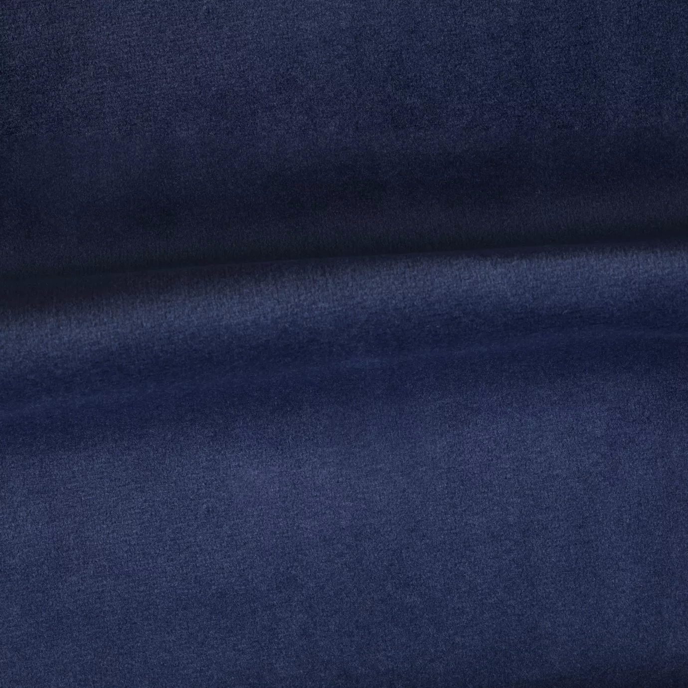 Soft and elegant close-up of a Venice Velvet 65 fabric swatch in a deep and sophisticated blue tone, showcasing its velvety texture and a delicate sheen that gives it a feeling of comfort and timeless elegance.