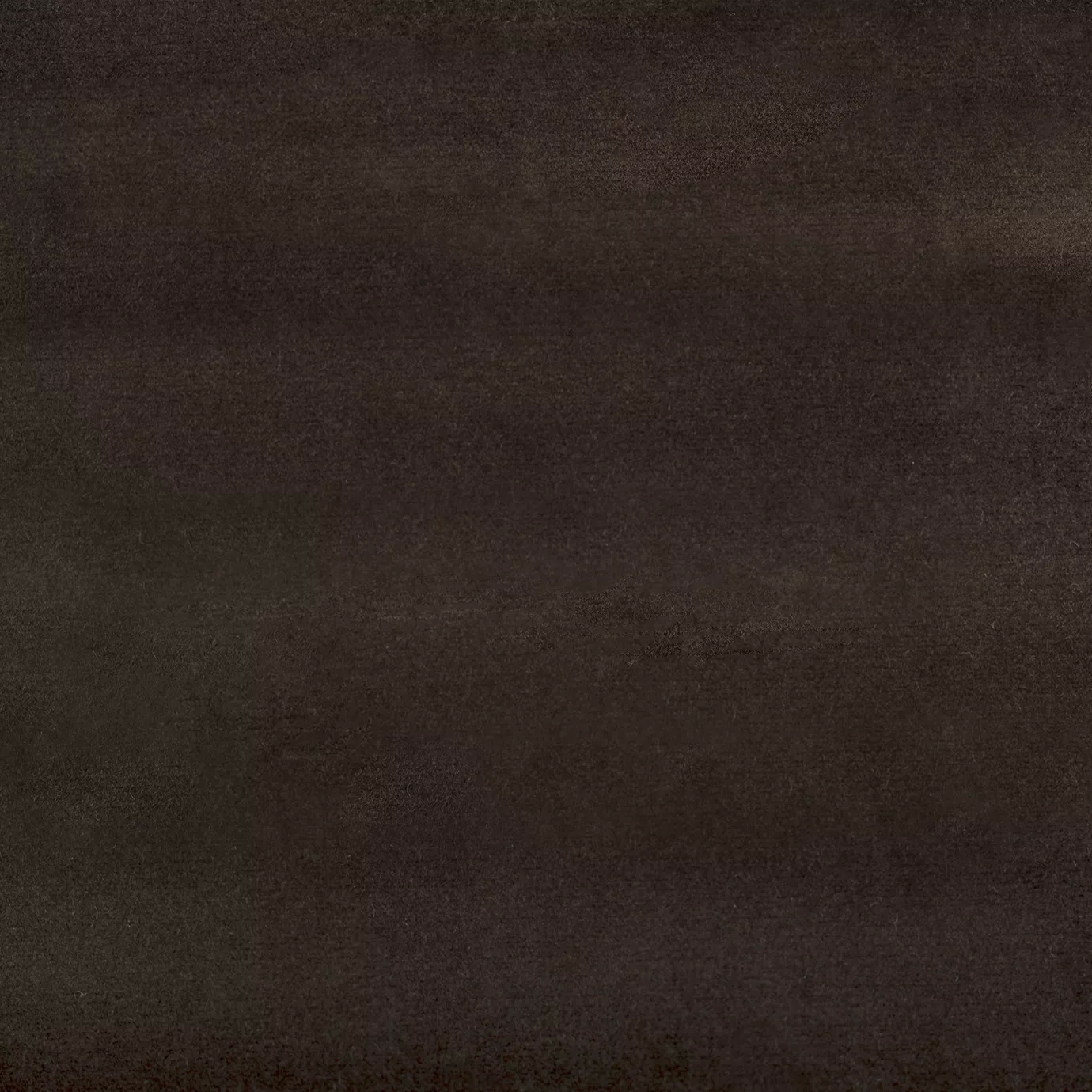 Soft close-up of a Smooth Velvet Chocolate fabric swatch in a rich and elegant chocolate brown tone, showcasing its velvety texture and a gentle sheen that gives it a feeling of sophistication and cozy comfort.