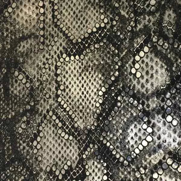Elegant close-up of a Bitis Silver leather swatch with an exotic pattern mimicking snake skin in shades of black, gray, and silver, featuring a slightly rough texture with distinct scales and shimmering details, evoking a feeling of modernity and bold sophistication.