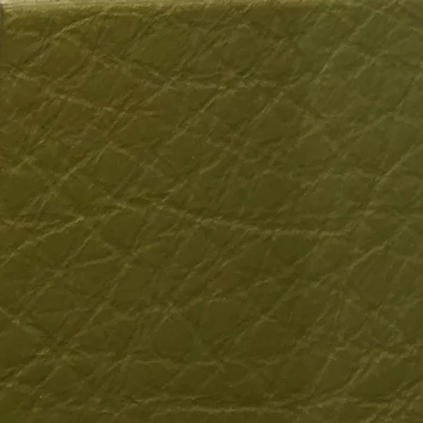 Close-up of a Harbor Avocado fabric swatch in a soft avocado green tone with texture, showcasing its raised areas and grooves that give it a natural and elegant feel. The soft sheen highlights the depth of its texture.