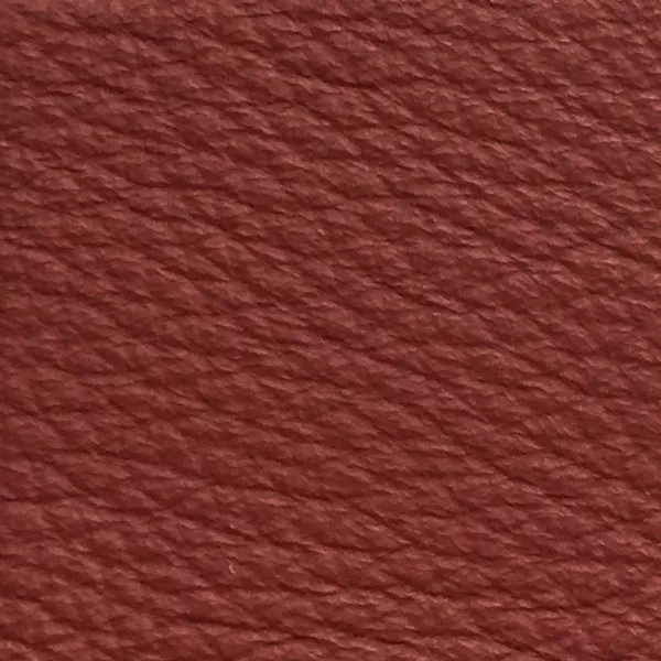 Close-up of a Harbor Burnt Henna fabric swatch in a warm reddish-brown tone with texture, showcasing its raised areas and grooves that give it a natural and elegant feel. The soft sheen highlights the depth of its texture.