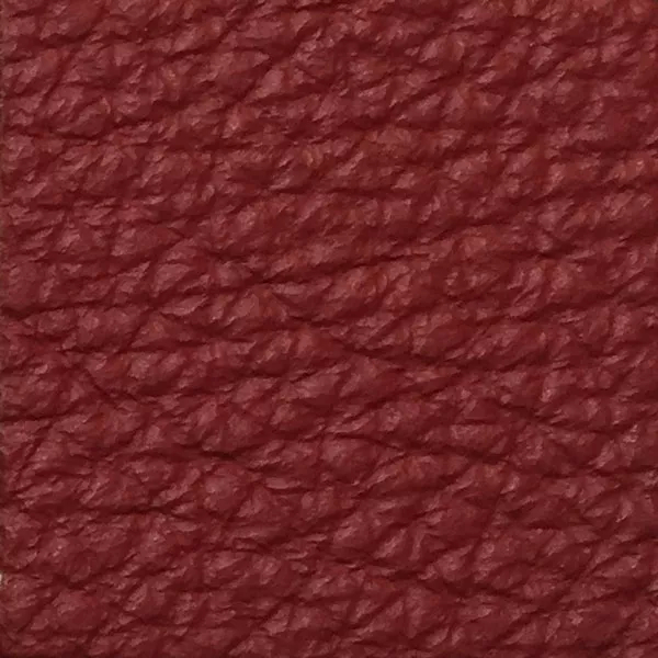 Close-up of a Harbor Chili Pepper fabric swatch in a vibrant chili pepper red tone with texture, showcasing its raised areas and grooves that give it a natural and elegant feel. The soft sheen highlights the depth of its texture.