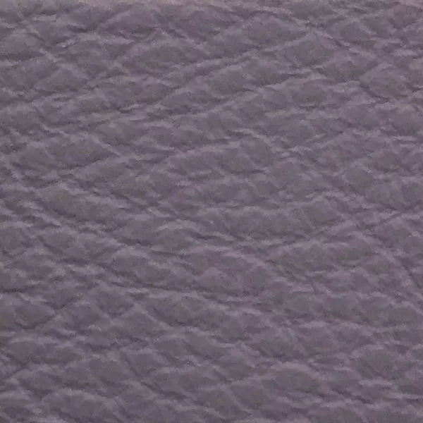 Close-up of a Harbor Eventide fabric swatch in a soft grayish-lilac tone with texture, showcasing its raised areas and grooves that give it a natural and elegant feel. The soft sheen highlights the depth of its texture.