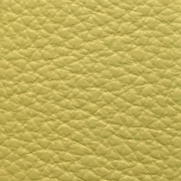 Close-up of a Harbor Leek Green fabric swatch in a soft leek green tone with texture, showcasing its raised areas and grooves that give it a natural and elegant feel. The soft sheen highlights the depth of its texture.