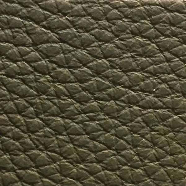 Close-up of a Harbor Lichen Green fabric swatch in a grayish moss green tone with texture, showcasing its raised areas and grooves that give it a natural and elegant feel. The soft sheen highlights the depth of its texture.