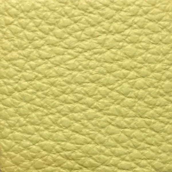 Close-up of a Harbor Linden Green fabric swatch in a soft linden green tone with texture, showcasing its raised areas and grooves that give it a natural and elegant feel. The soft sheen highlights the depth of its texture.